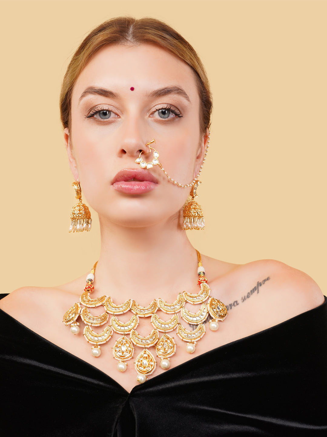 Luxury Indian necklace set for brides by AIVY LUXE featuring gold-toned intricate design with matching earrings and nose ring