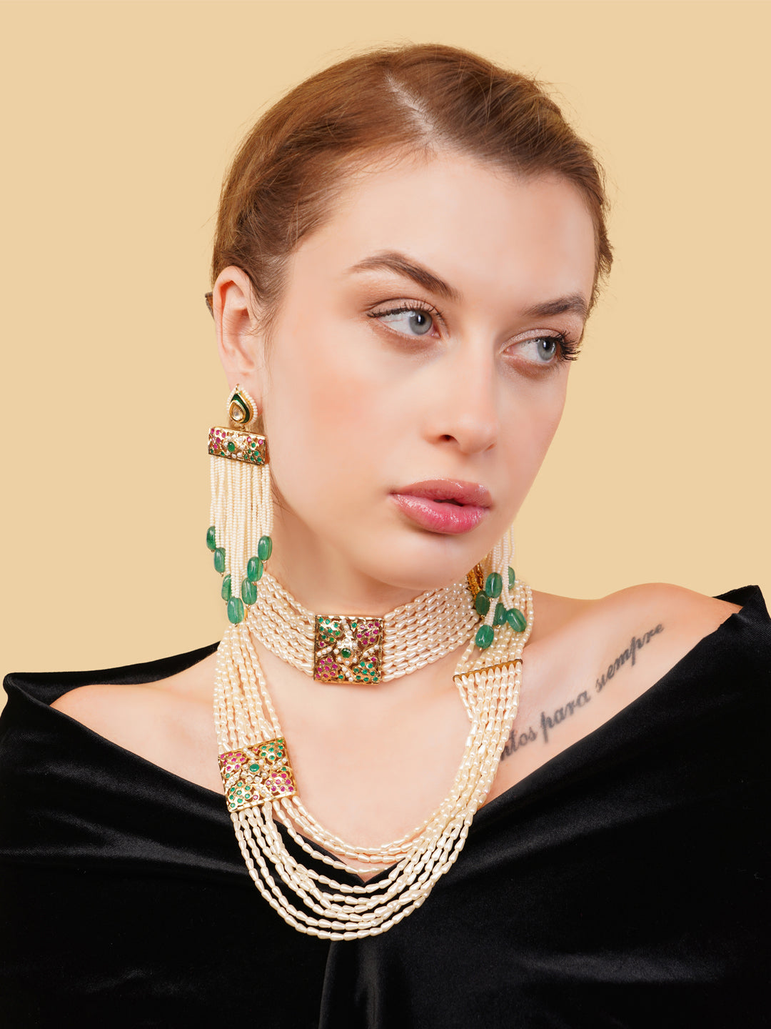 AIVY LUXE luxury Indian necklace with pearls featuring green and gold detailing worn by a model
