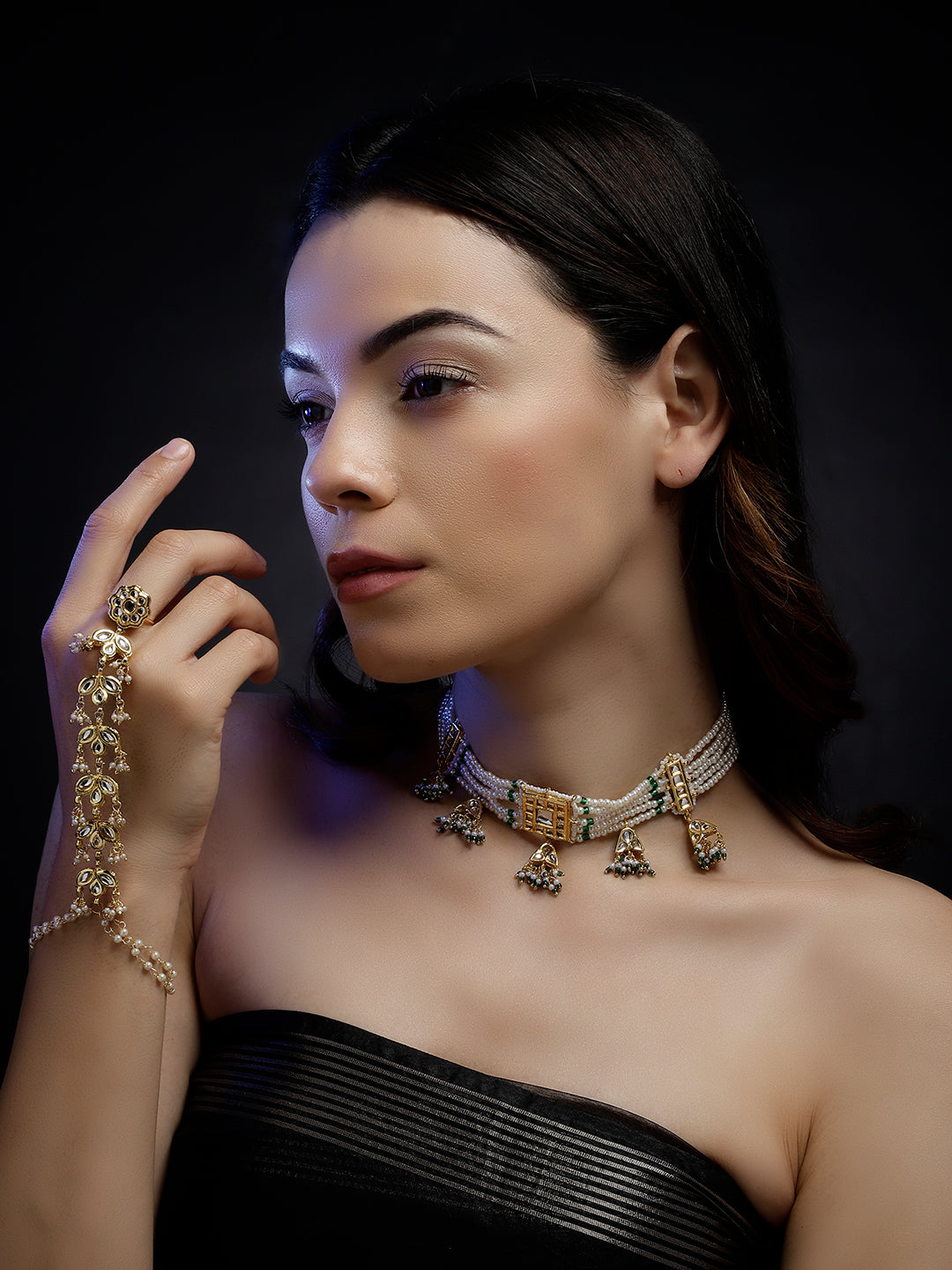 Model wearing AIVY LUXE luxury pearl choker necklace with gold and gemstone accents