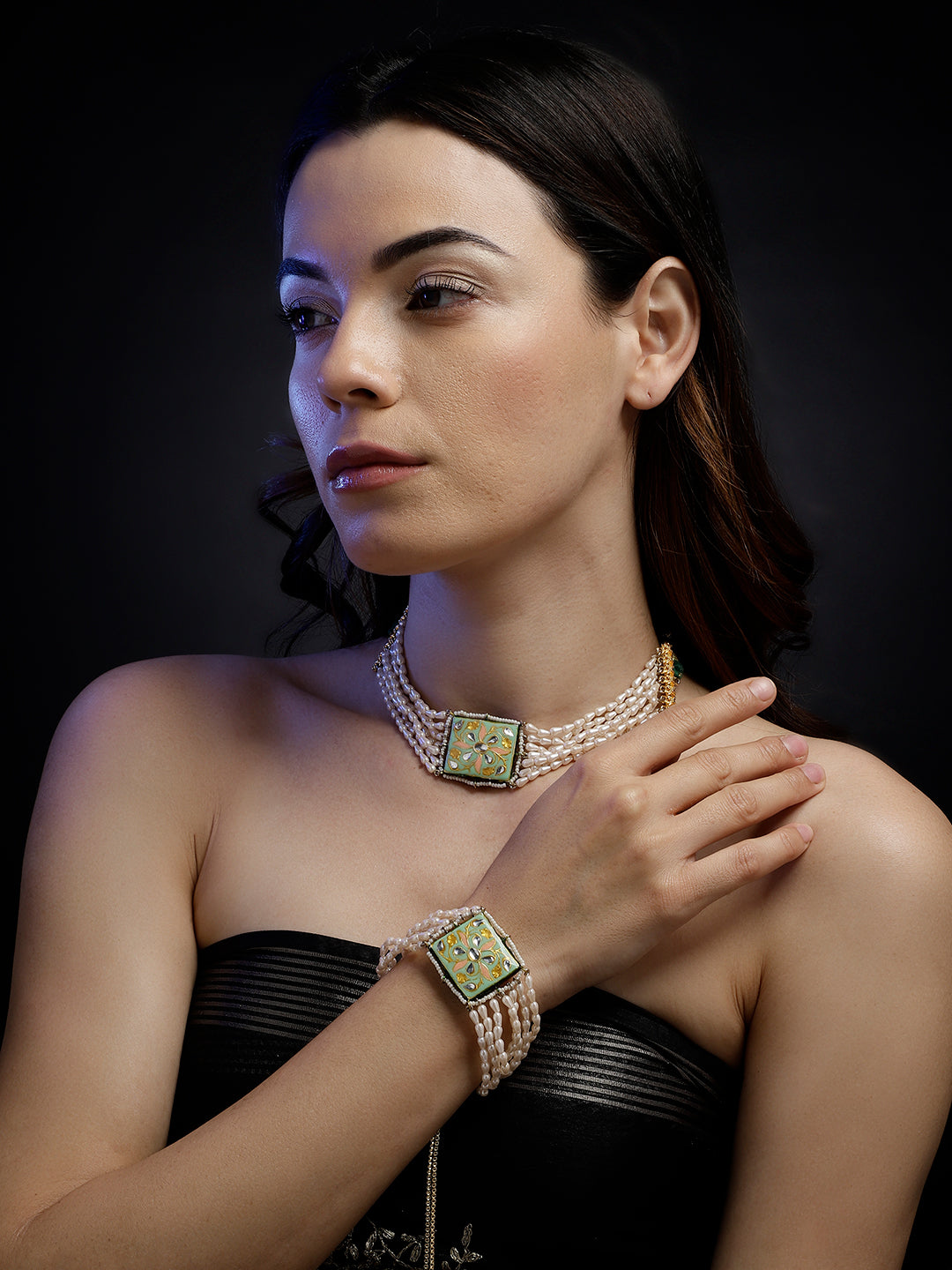 AIVY LUXE pearl choker necklace with multiple strands and a decorative centerpiece worn by a woman