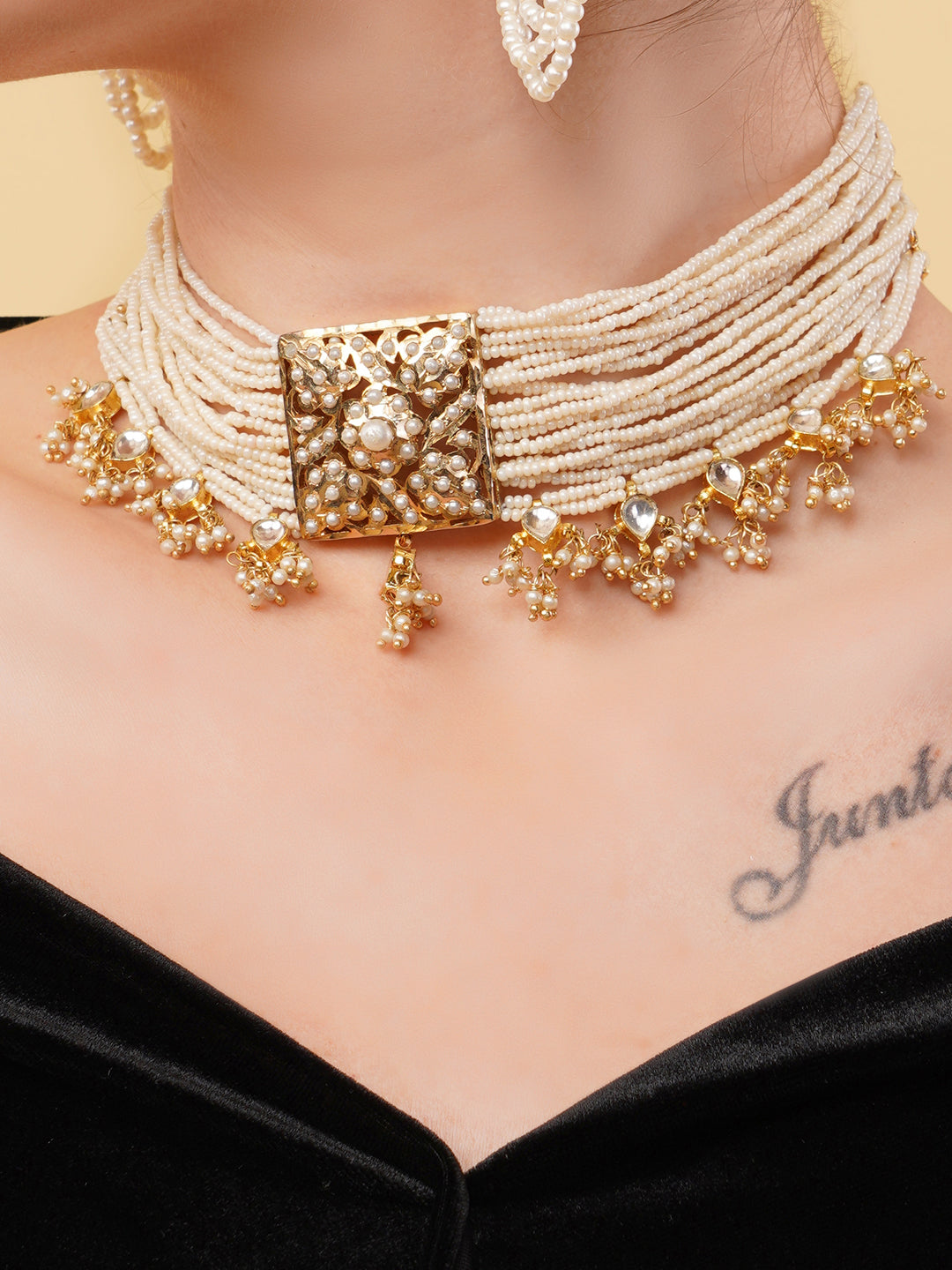 Pearl choker with gold detailing featuring multiple strands and intricate gold embellishments by AIVY LUXE