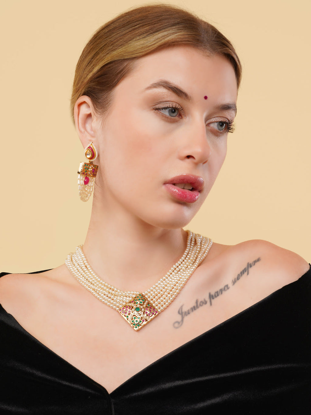 AIVY LUXE pearl embellished drop earrings worn by model with layered pearl necklace and black velvet top