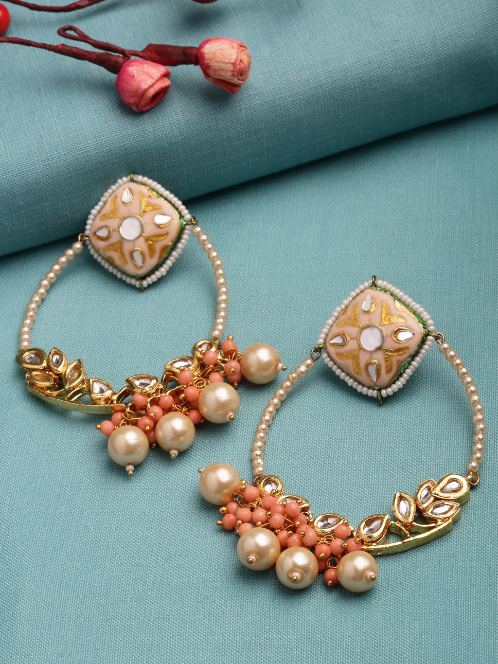 AIVY LUXE pearl embellished hoop earrings with intricate gold details and coral bead accents on teal fabric