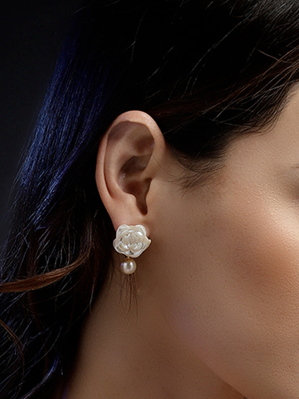 AIVY LUXE Roshni-e-Chandni statement earrings with white floral design and pearl drop on model's ear