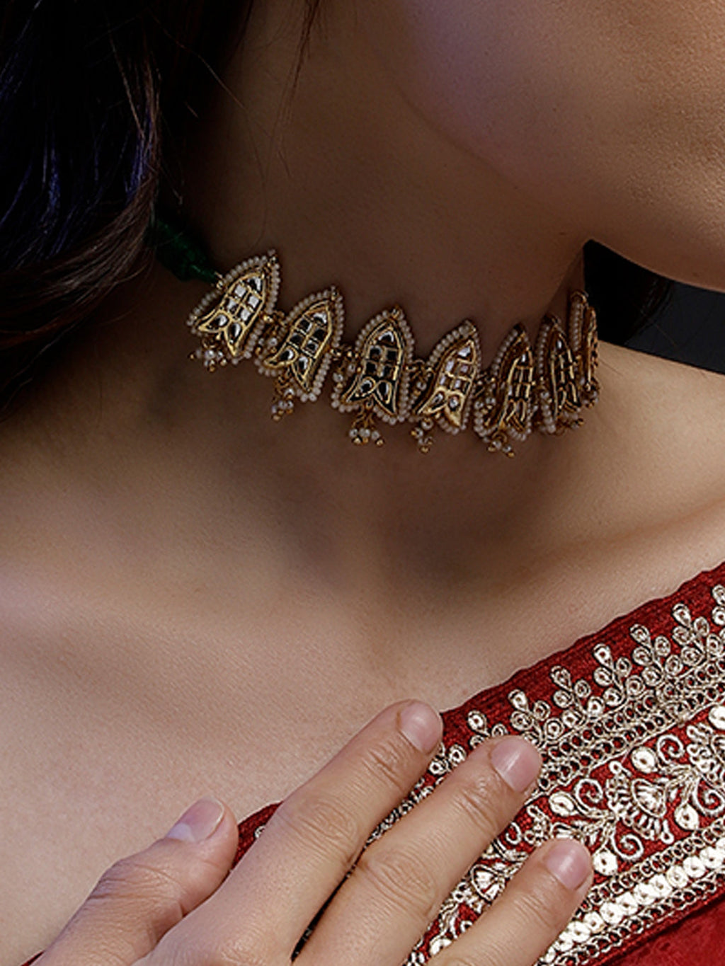 AIVY LUXE Sabz-e-Roshni statement jewelry gold choker necklace worn with red embroidered outfit