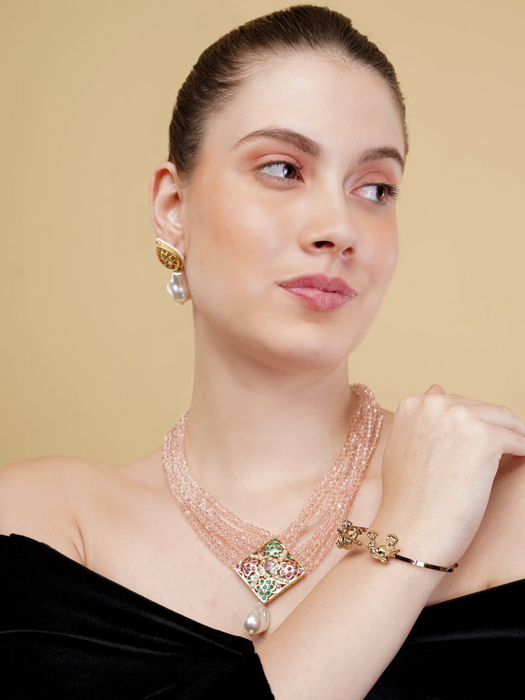 AIVY LUXE statement pearl necklace with multi-strand beads and colorful gemstone pendant worn by a woman