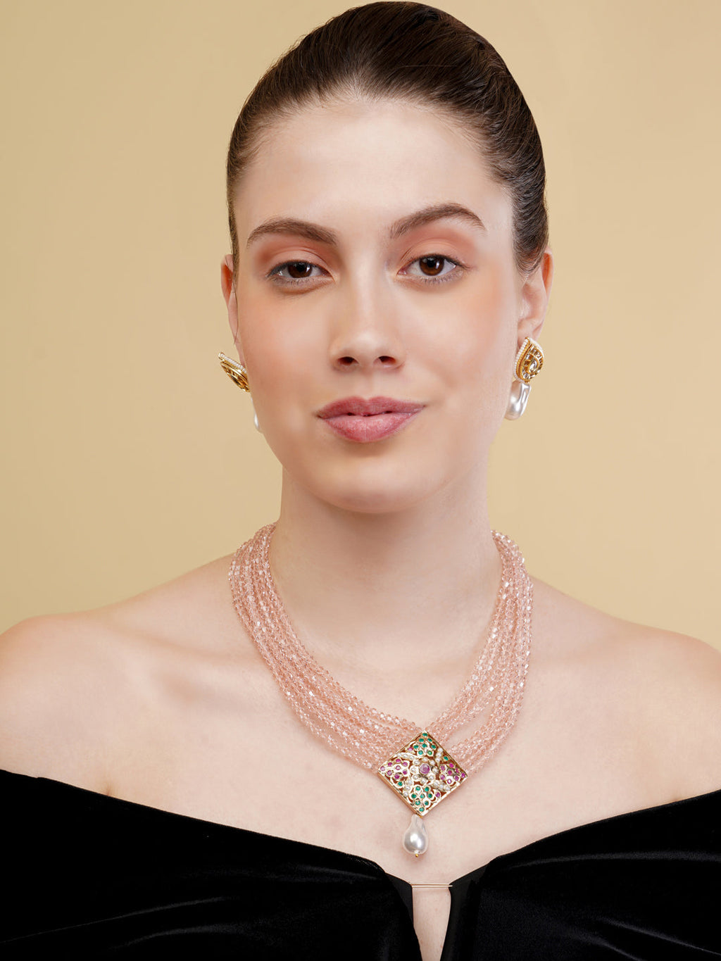 AIVY LUXE statement pearl necklace with a multi-strand pink beaded design and decorative pendant on model