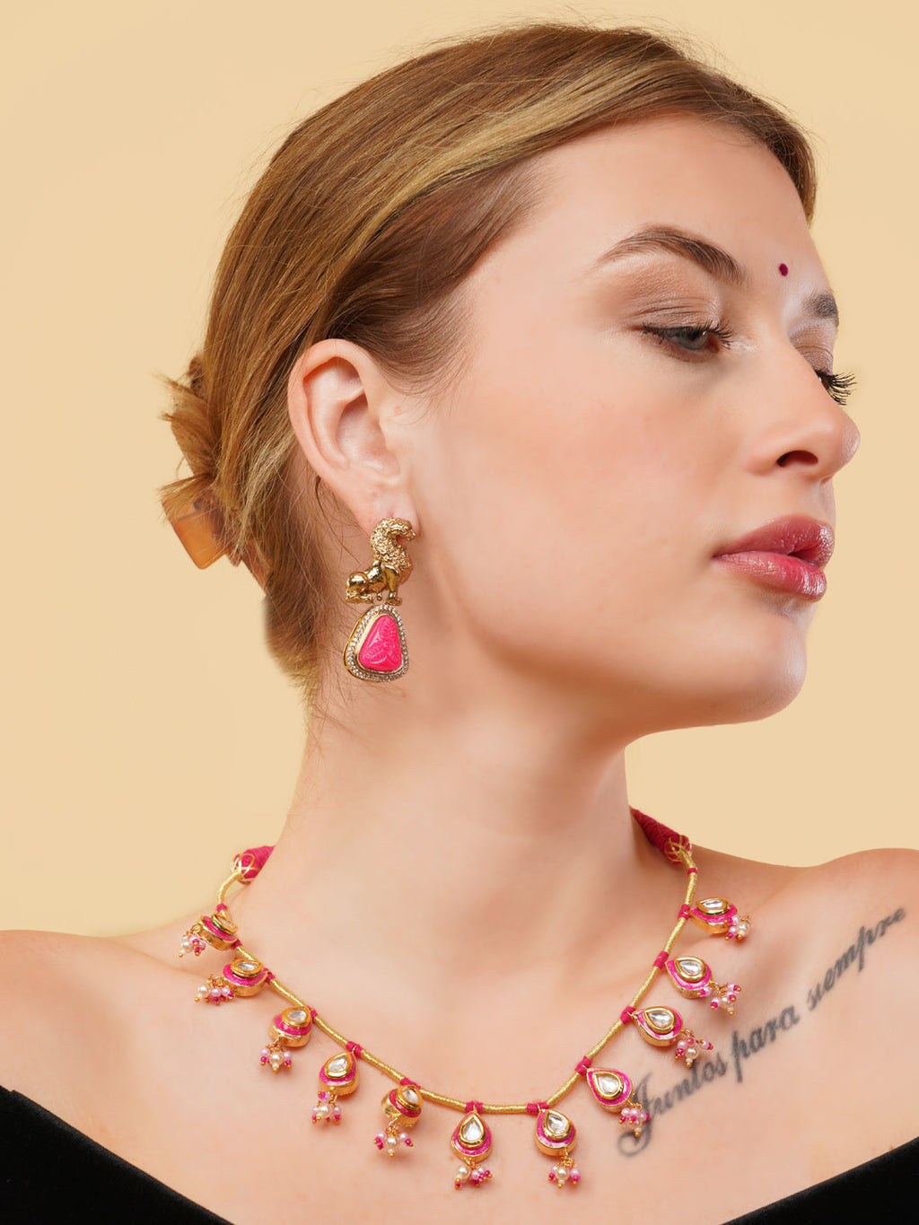 AIVY LUXE statement pink gemstone necklace with gold accents worn by a woman with matching earrings