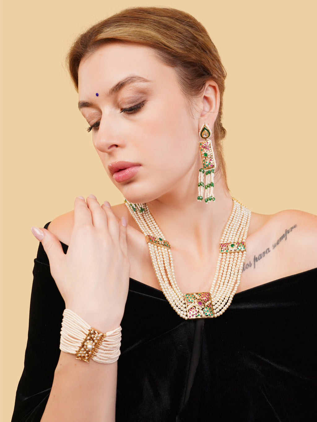 AIVY LUXE stunning pearls drop earrings worn with matching pearl necklace and bracelet on woman