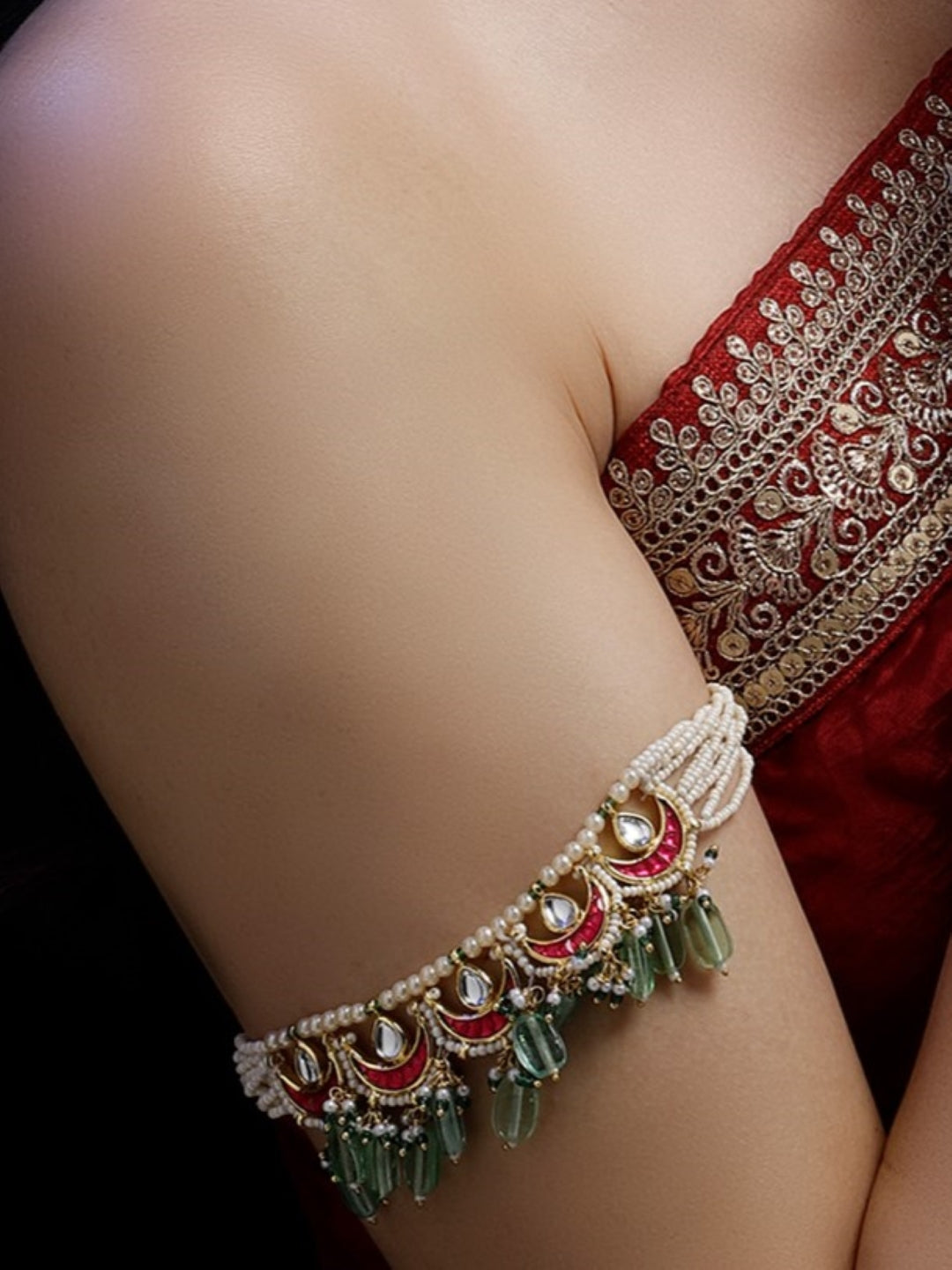 AIVY LUXE traditional gemstone bajuband with pearls green and red gemstones on upper arm