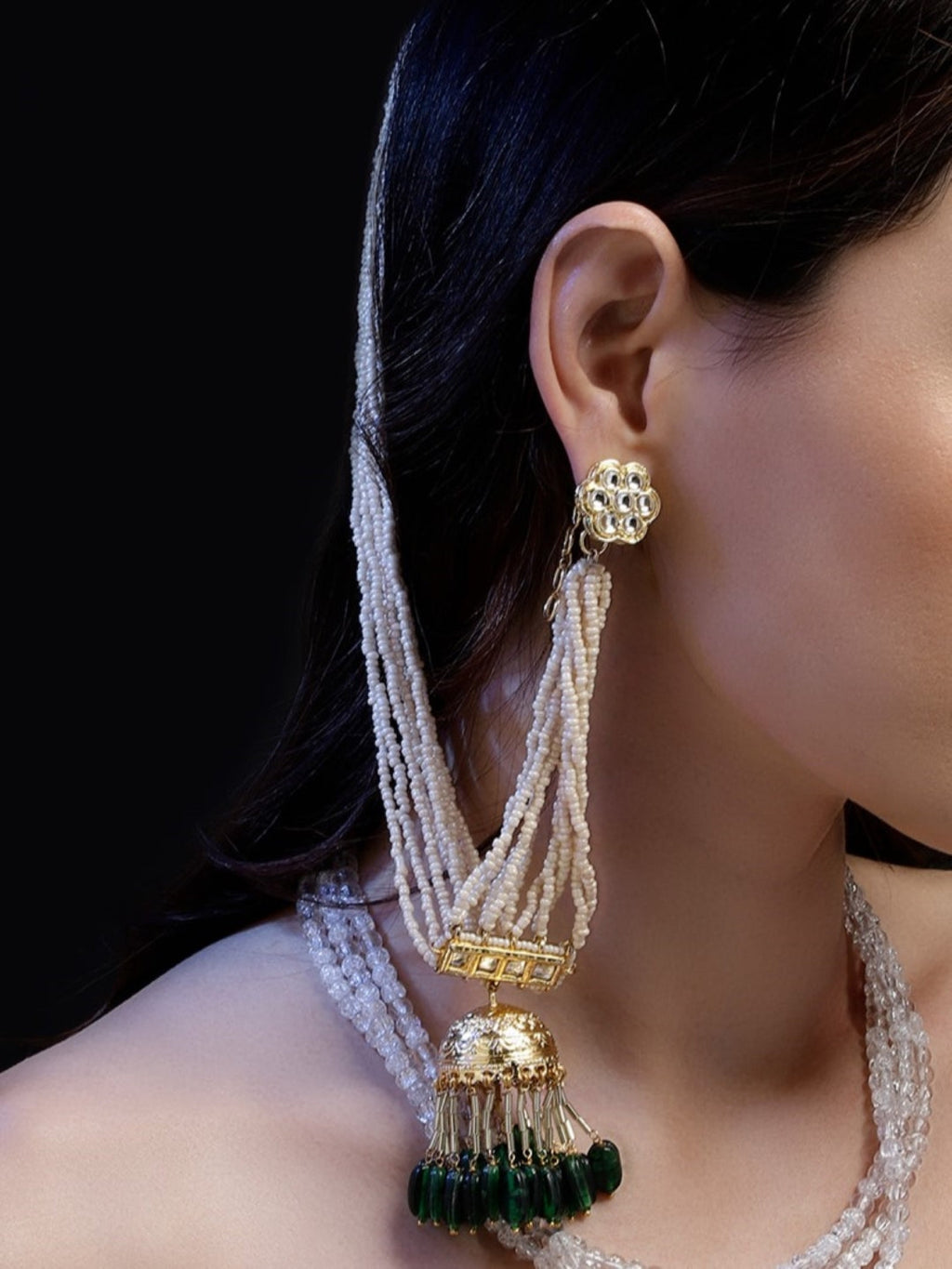 AIVY LUXE traditional green dangle earrings with white beads and gold accents on a model