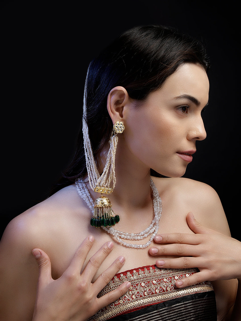 AIVY LUXE traditional green dangle earrings worn by a woman paired with layered white bead necklace and ethnic attire