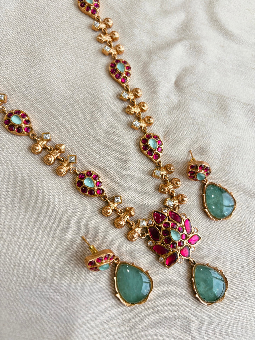 AIVY LUXE traditional green stone necklace set with gold accents and red and white detailing