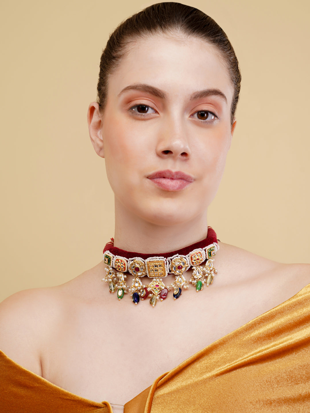 AIVY LUXE traditional Indian choker jewelry with intricate gold detailing and colorful gemstones on velvet band