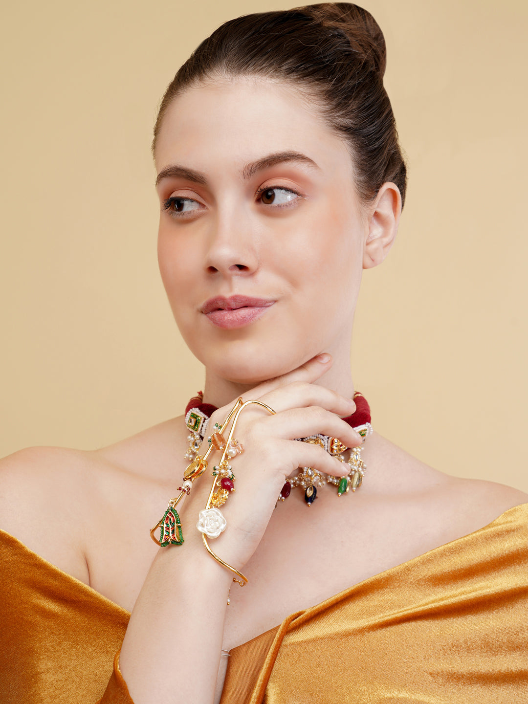 AIVY LUXE traditional Indian choker jewelry worn by a woman with a golden off-shoulder dress