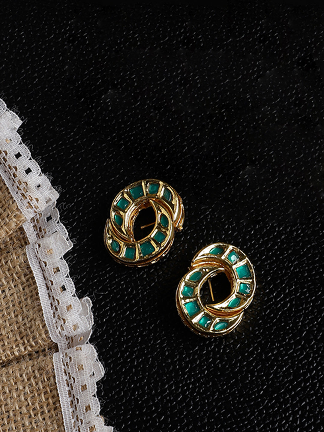 AIVY LUXE unique shamrock statement earrings with green enamel and gold-tone design on black background