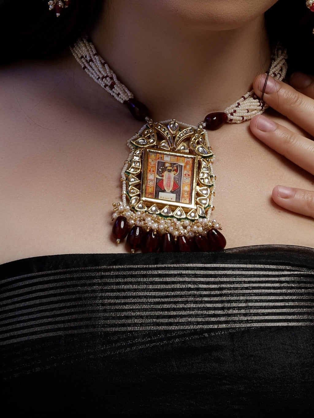 AIVY LUXE Anar-e-Zar Haar necklace featuring an ornate pendant with red stones and pearl detailing