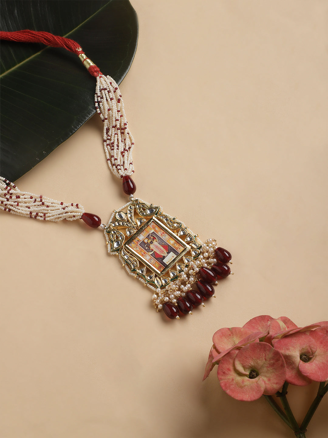 AIVY LUXE Anar-e-Zar Haar necklace with intricate beads and ornate pendant featuring red and white accents