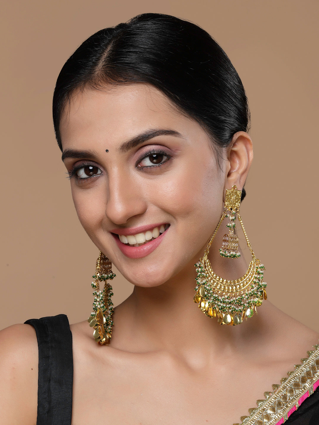 AIVY LUXE chand bali earrings gold worn by woman with intricate design and green accents