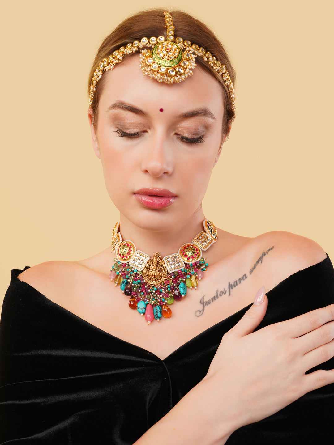 Colourful authentic Indian necklace by AIVY LUXE worn with matching headpiece on model in black outfit