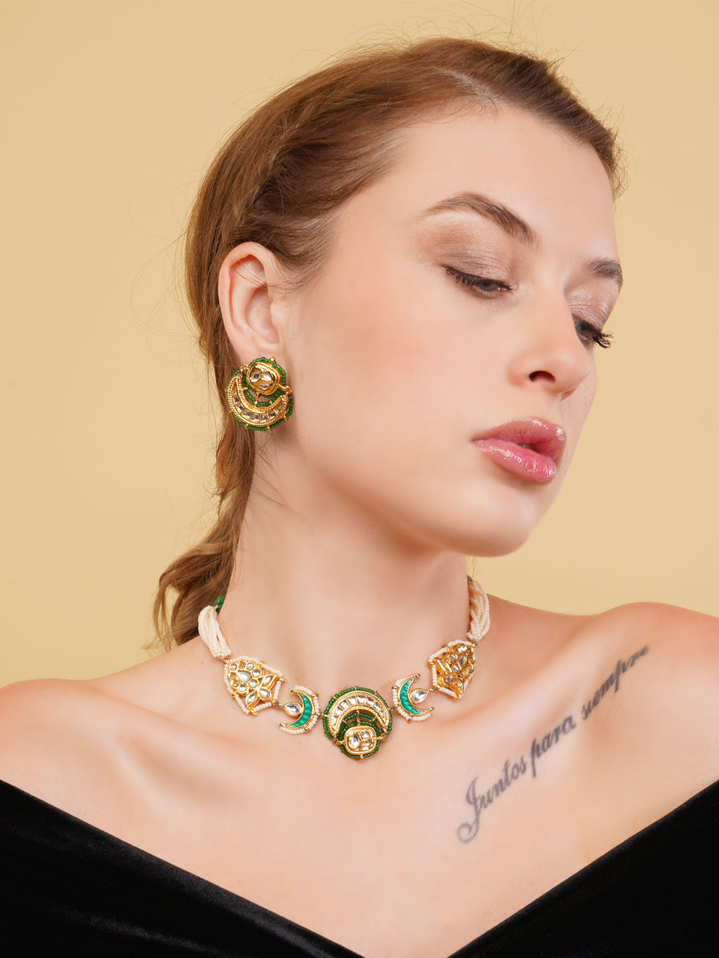 AIVY LUXE green gold statement jewelry set featuring a detailed necklace and matching earrings on a model