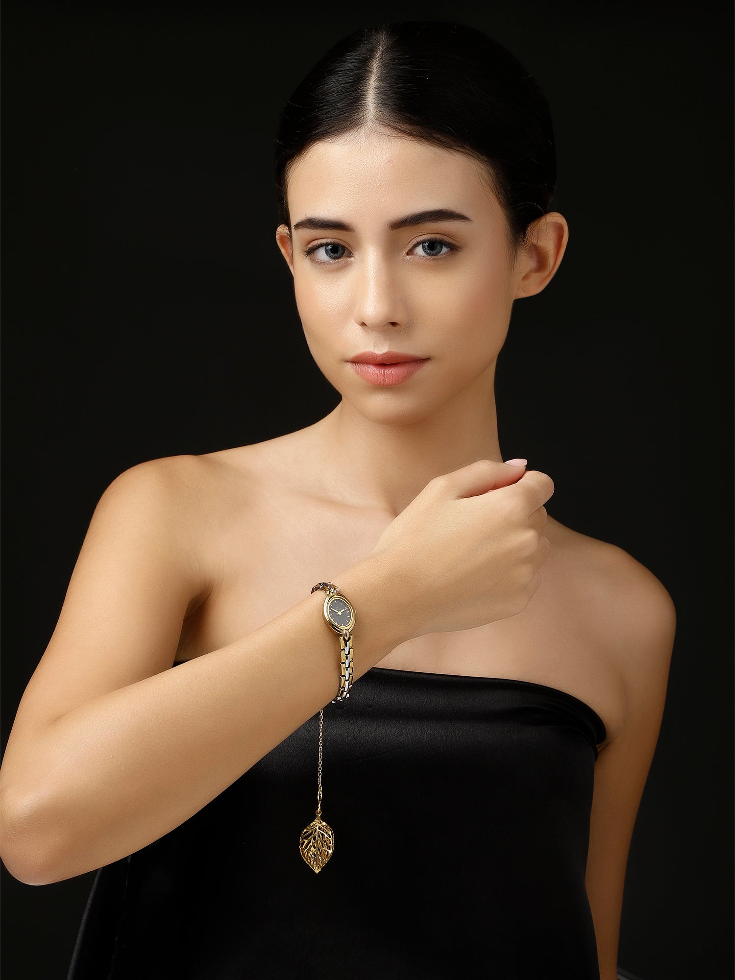 AIVY LUXE handcrafted watch charm for women featuring a delicate gold leaf pendant on a stylish wristwatch