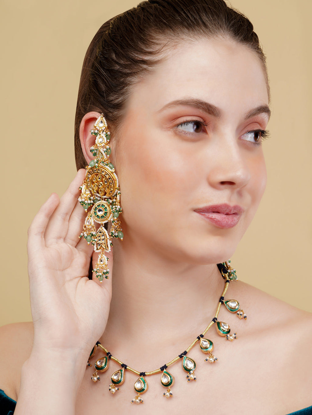 AIVY LUXE luxury Indian necklace for women with intricate green and gold design worn by woman