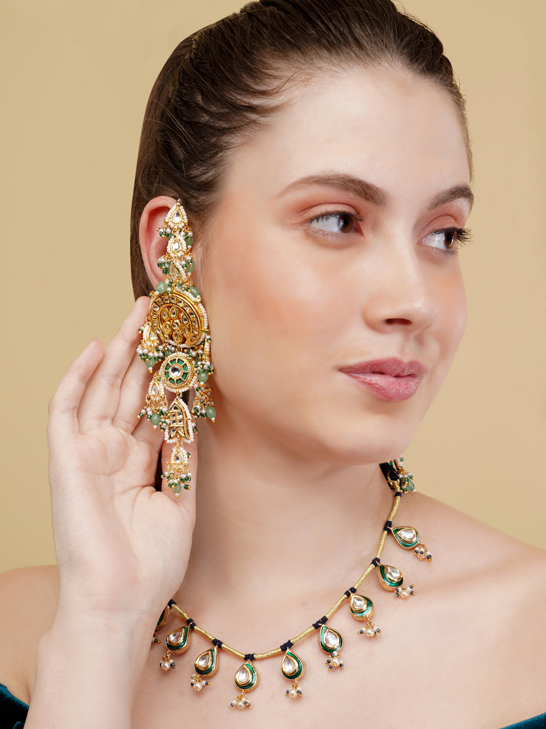 Luxury Indian necklace for women with gold and green gemstone design by AIVY LUXE
