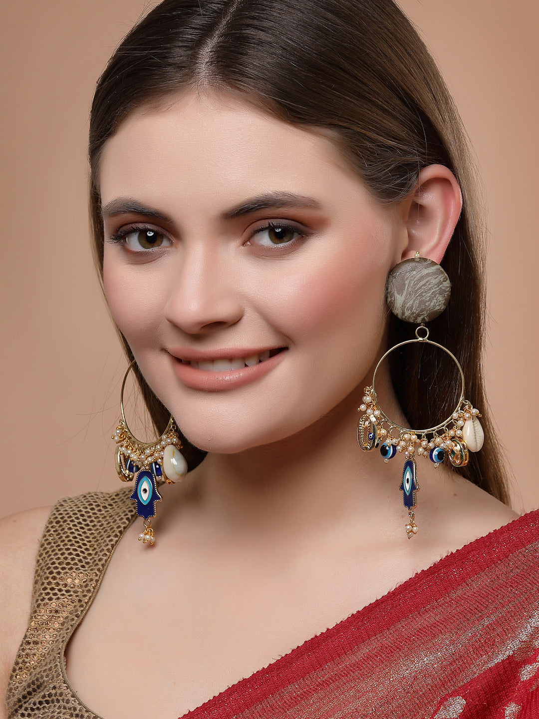 AIVY LUXE shamrock chand bala earrings with blue and white beads worn by a woman