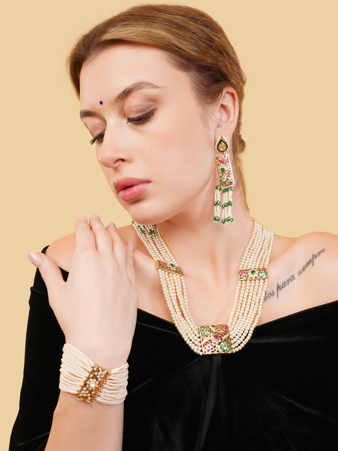 AIVY LUXE statement bridal bracelets featuring layered pearls and gold accents worn with matching earrings and necklace