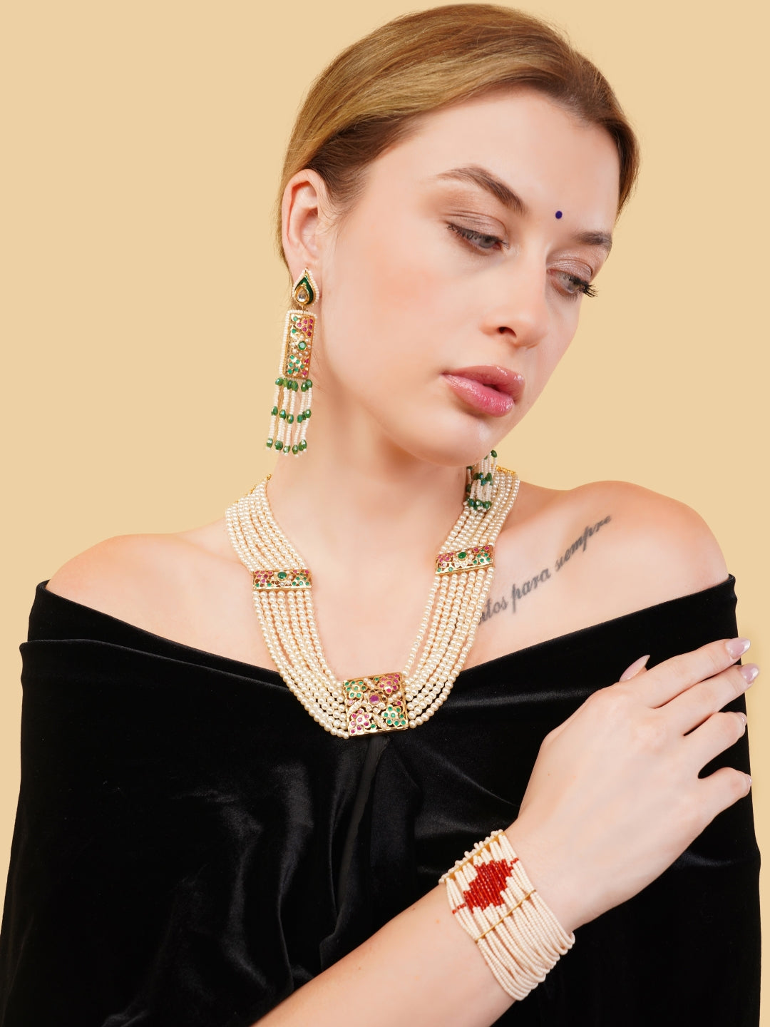 AIVY LUXE statement bridal bracelets worn with matching pearl and green stone jewelry set on model