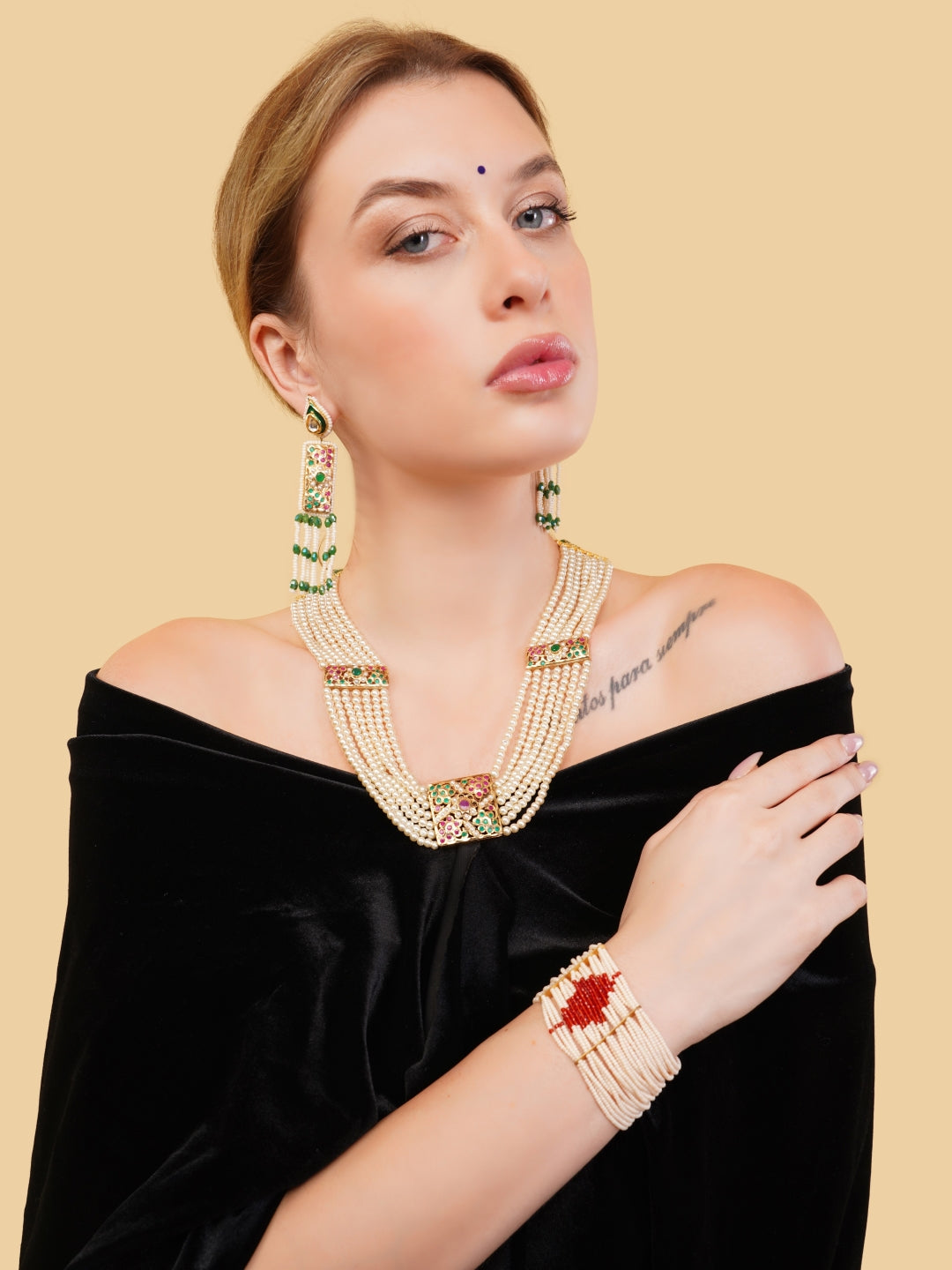 AIVY LUXE statement bridal bracelets featuring an elegant multi-strand pearl design with red and green accents